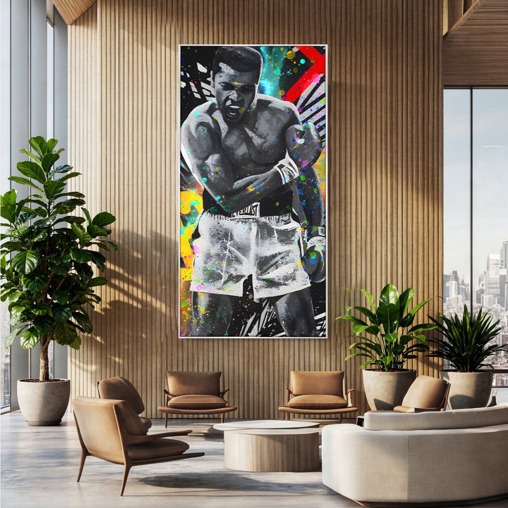 Tablou canvas cu tablou canvas cu muhammad ali in alb si negru, in rama de aluminiu argintiu, pe perete intr-un birou